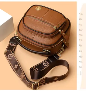 Stylish brown leather cross-body bag with multiple layers, large capacity and wide strap.