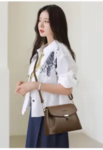 Elegant brown PU leather crossbody shoulder bag for women, featuring chic flap design and metal lock.