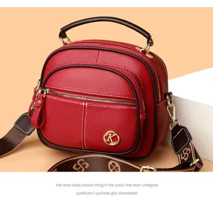 Stylish red PU leather crossbody bag, multi-layer large capacity shoulder bag detail.