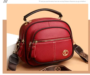 Red soft leather multi-layer apple crossbody bag with top handle and stylish guitar strap.