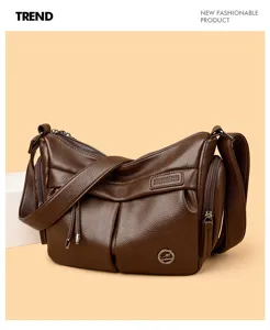 Close-up detail of dark brown leather hobo bag showing soft texture and multi pockets.