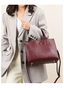 Vintage oil wax leather tote bag detail, minimalist design, elegant commuter handbag for women.