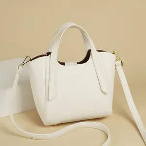 Stylish white PU leather tote bag with top handle and comfortable shoulder strap for women.