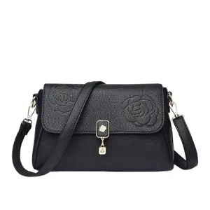 Schwarze Umhängetasche aus Leder für Damen, elegante Handtasche mit stilvollem Blumenmuster.
