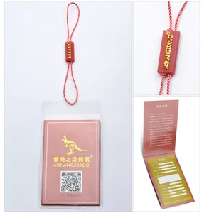 Detailed view of women handbag brand tag, warranty card, and authentic security seal.