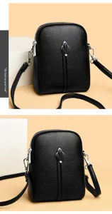Black leather crossbody detail showing texture, double zippers, and chic metallic pendant ornament.