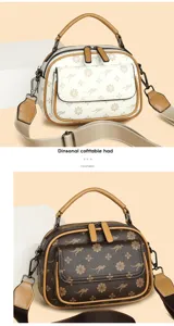 Close-up details of women's leather crossbody bag with top handle, double zipper, and elegant pattern.
