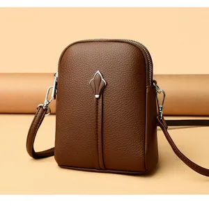 Chic brown leather small crossbody bag detailed view, stylish phone purse for women use.