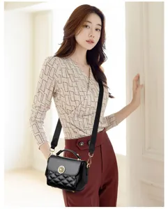 Detailed shot of the elegant black quilted crossbody bag showing fine leather texture and hardware.