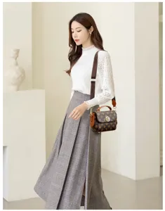 Chic vintage monogram shoulder bag for women, stylish crossbody bag with top handle and strap.