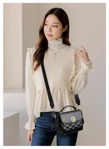 Chic black quilted crossbody bag for women, featuring elegant gold hardware and wide strap.