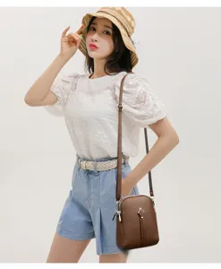 Chic brown leather crossbody bag paired with stylish outfit, perfect for daily casual wear.