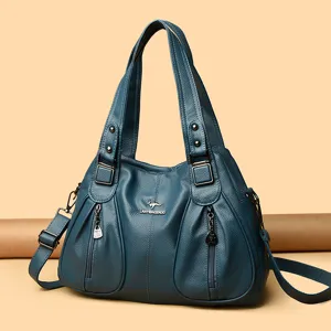 Elegant teal leather women handbag with top handles and crossbody strap, spacious everyday tote.