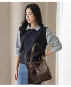 Detailed view of women casual PU leather shoulder crossbody tote bag in rich dark brown color.
