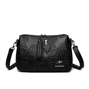 Black embossed leather crossbody shoulder bag for women, stylish large capacity tote purse.