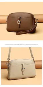 Stylish women leather shoulder crossbody bag with dome design and metal ring detail.