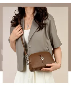 Brown leather crossbody bag for women, stylish casual shoulder bag with metal ring clasp.