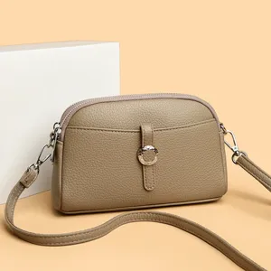 Stylish women leather crossbody bag casual shoulder handbag with chic ring buckle design.