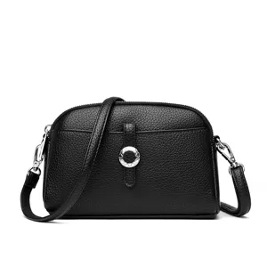 Classic black leather crossbody bag for women with chic metal ring accent and silver hardware.