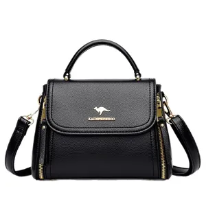 Black soft leather handbag for women, elegant top-handle crossbody bag with golden hardware.