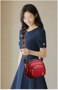 Women red soft leather multi-layer crossbody shoulder bag with stylish monogram strap.