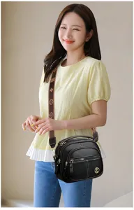 Stylish black soft leather multi-layer crossbody bag with patterned strap for daily wear.