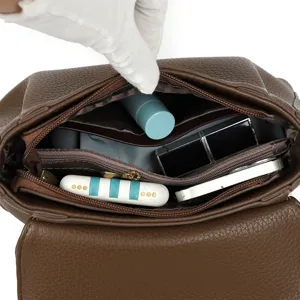 Brown PU leather shoulder bag interior capacity display, multi-compartment design for daily use.