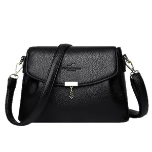 Elegant black PU leather women crossbody bag featuring chic flap closure and metal leaf pendant.
