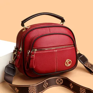 Red soft leather multi-layer crossbody shoulder bag for women with top handle and strap.