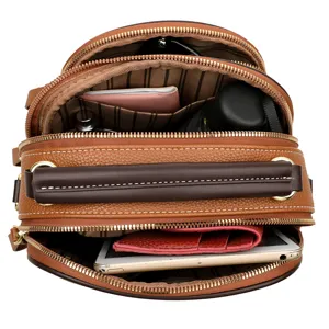 Women's brown soft leather multi-compartment casual backpack and stylish shoulder bag with large capacity.