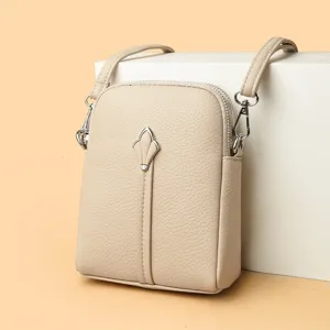 Beige small crossbody bag for women, minimalist pu leather shoulder bag with stylish metal hardware.