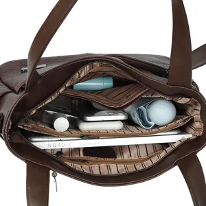 Stylish brown PU leather tote bag with multi-compartment interior for daily women use.