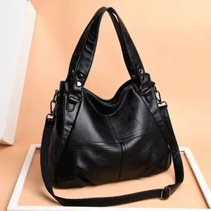 Black genuine leather shoulder bag for women, large capacity soft tote handbag with strap.