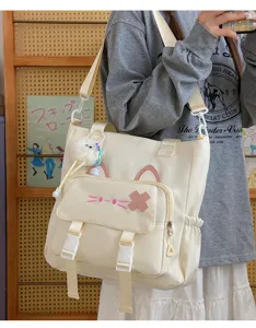 Cute kitten canvas shoulder bag, large capacity student travel messenger bag with cat ears.