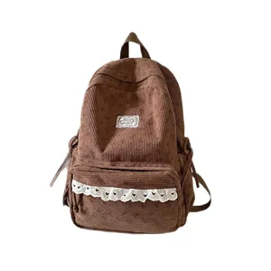 Cute corduroy backpack for women, casual school bookbag with lace trim and large capacity.