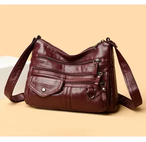 Wine red multi-pocket PU leather shoulder bag detail view, multi-zipper design, elegant style
