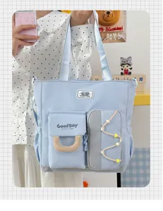 Bolso de hombro de lona azul claro con bolsillos vista de detalle, bolso casual estudiante.