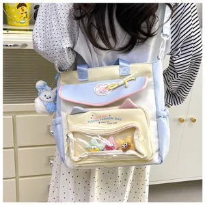 Cute canvas shoulder bag with transparent front pocket, large capacity student backpack for school.