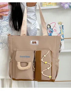 Bolso de lona grande tipo tote con múltiples bolsillos para la escuela y el trabajo.