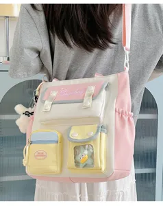 Japanese style college canvas shoulder bag with multiple pockets, pink and white design.