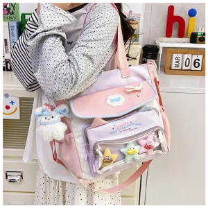 Cute multi-pocket canvas shoulder bag with transparent front pocket, pastel pink and purple.