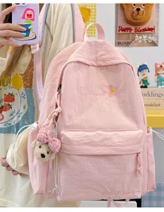 Cute pink casual backpack for women daily travel, sweet style school bag with cute pendant.