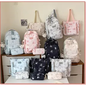 Multi-compartment school backpack set with cute cartoon print, durable student book bag.