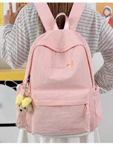Cute pink casual backpack for women and girls, lightweight school bookbag for daily travel.