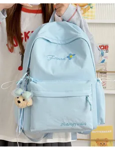 Light blue Japanese style campus backpack detail, featuring cute bear pendant and embroidery.