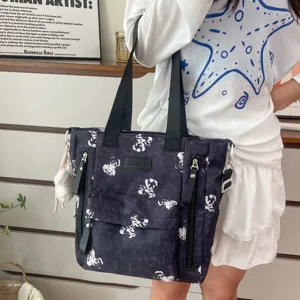 Multi-pocket canvas tote backpack for women, cute bear print school bag with fluffy pendant.