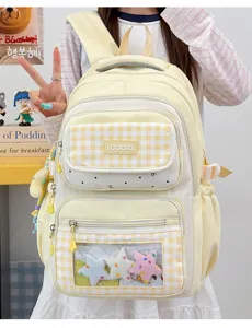 Detailed view of cute student plaid school backpack with transparent itabag window and plush stars.
