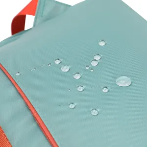 Waterproof backpack detail showing teal fabric texture and bright orange zipper elements.