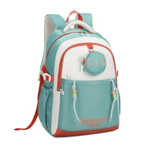 Teal and white school backpack detail, featuring a cute cat coin purse and beaded design.