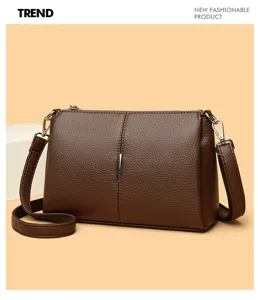 Brown leather crossbody bag for women, casual minimalist shoulder bag with smooth zipper.